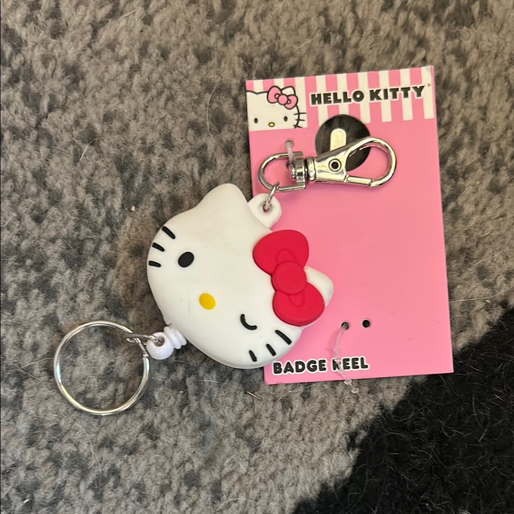 Hello Kitty White and Red Badge Reel Keychain
